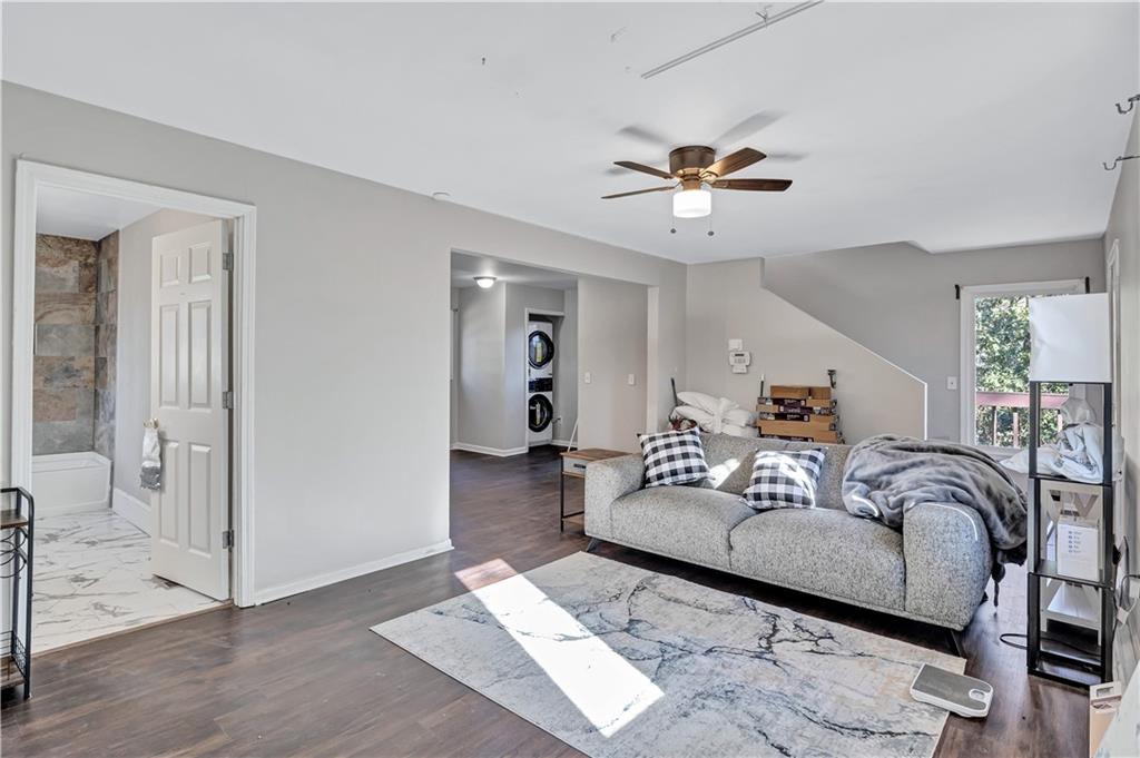 1920 Moores Mill Road Northwest Atlanta, GA 30318 - Photo 21 of 33 a living room with furniture and a ceiling fan