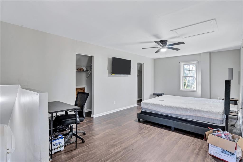 1920 Moores Mill Road Northwest Atlanta, GA 30318 - Photo 27 of 33 a bedroom with a bed and a window
