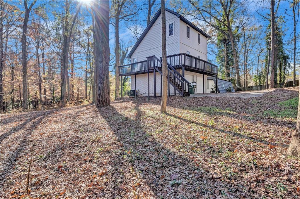 1920 Moores Mill Road Northwest Atlanta, GA 30318 - Photo 32 of 33 a view of a house with a yard covered with snow