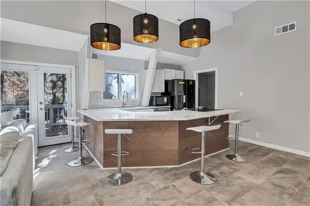a view of dining room cabinets and window