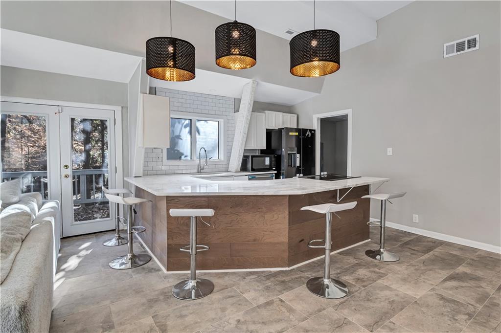 1920 Moores Mill Road Northwest Atlanta, GA 30318 - Photo 5 of 33 a view of dining room cabinets and window