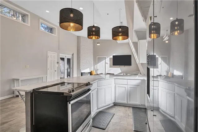 a kitchen with stainless steel appliances granite countertop a sink and cabinets