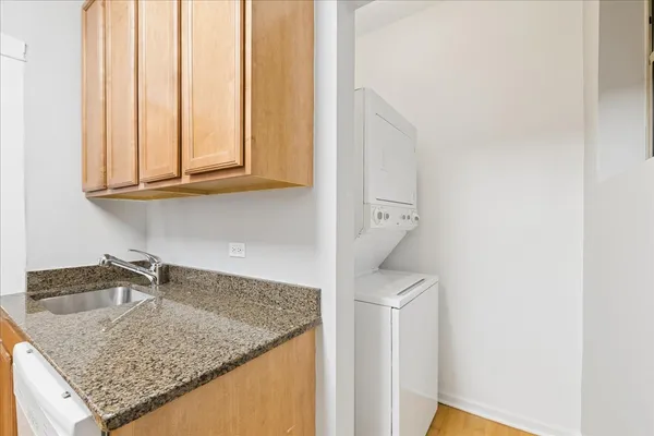 a kitchen with a sink a vanity and window