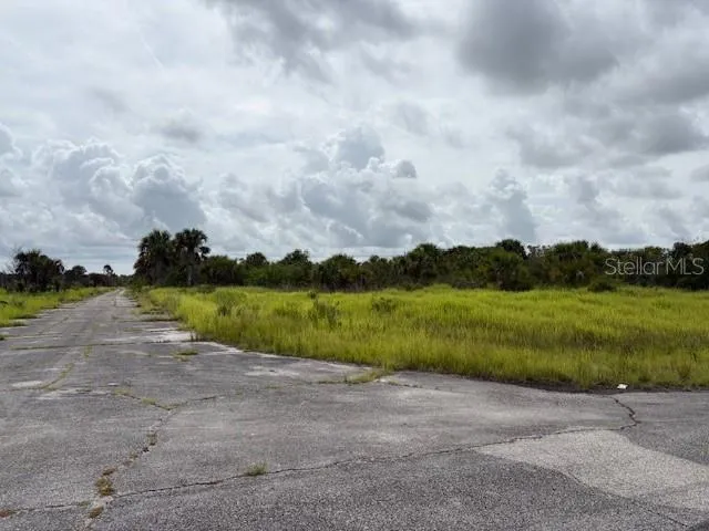 a view of a lake with a big yard
