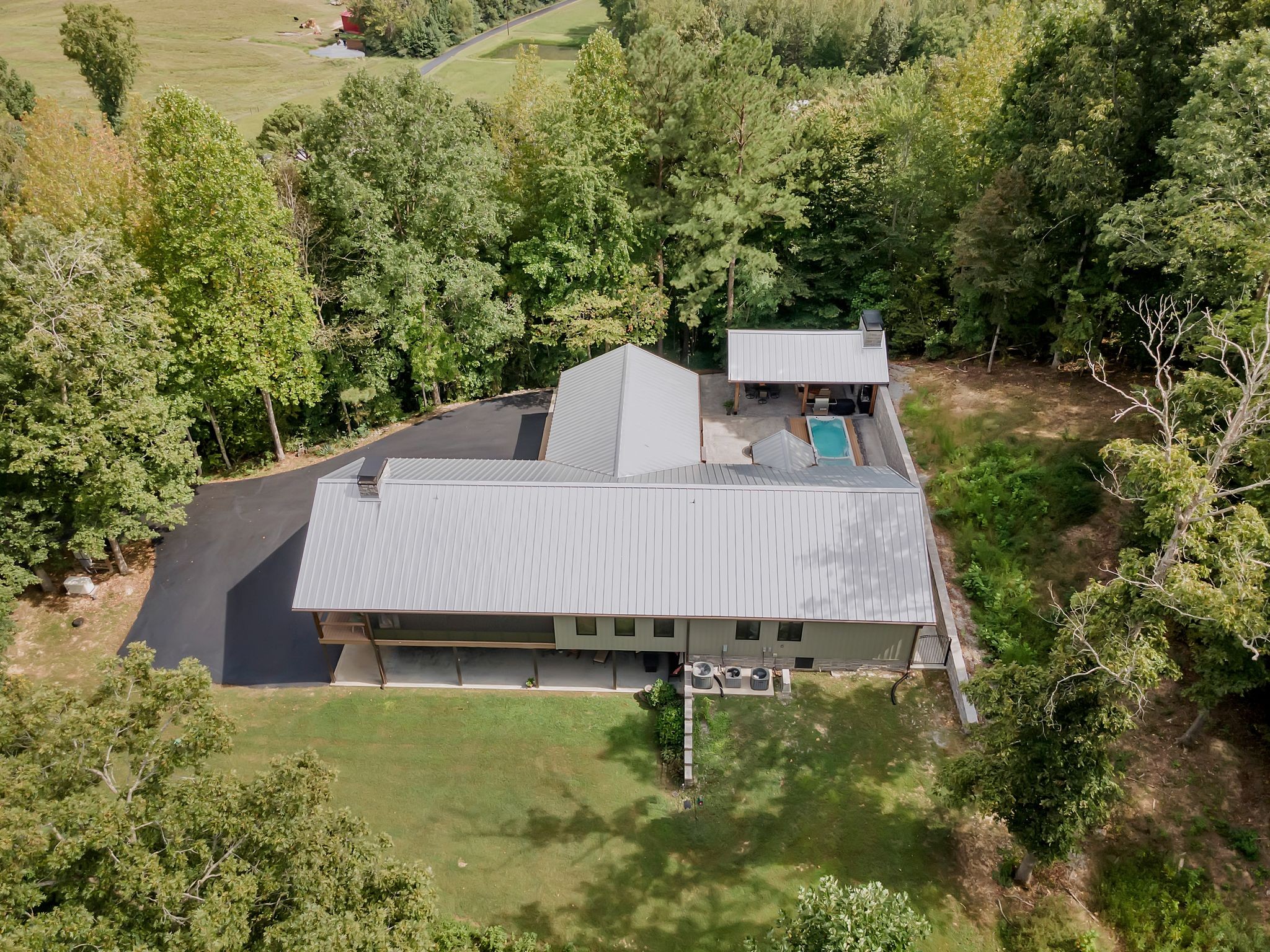 an aerial view of a house with a yard