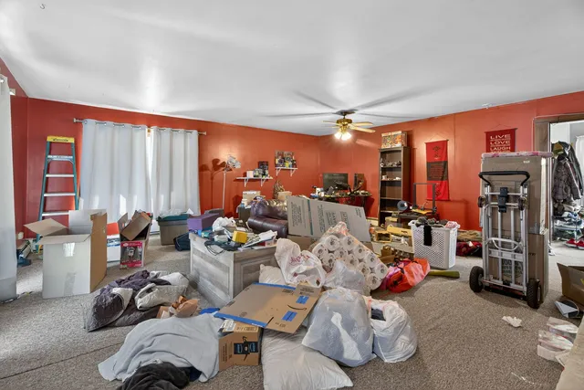 a room with gym equipment and a large window