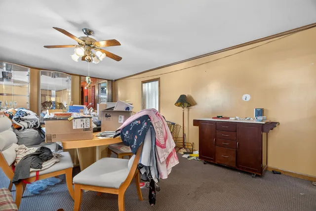 a view of a livingroom with furniture and a window