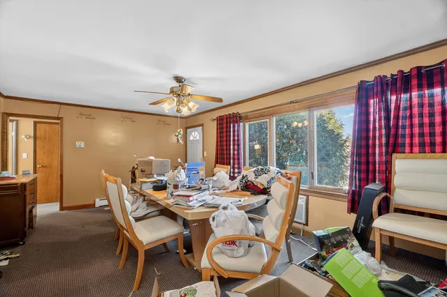 a dining room with furniture window and outside view