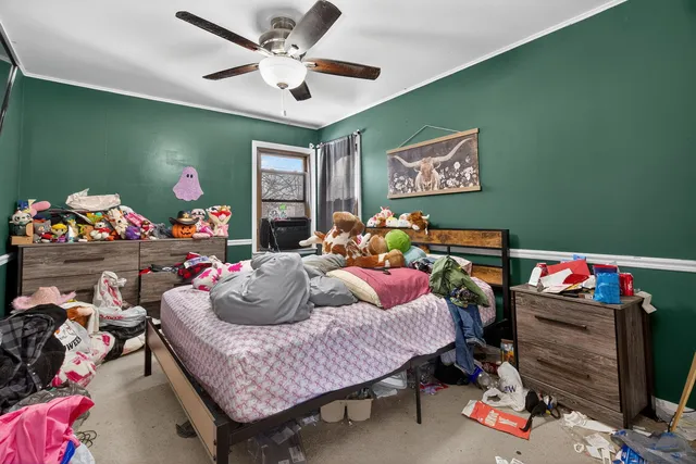 a bedroom with furniture and a wooden floor