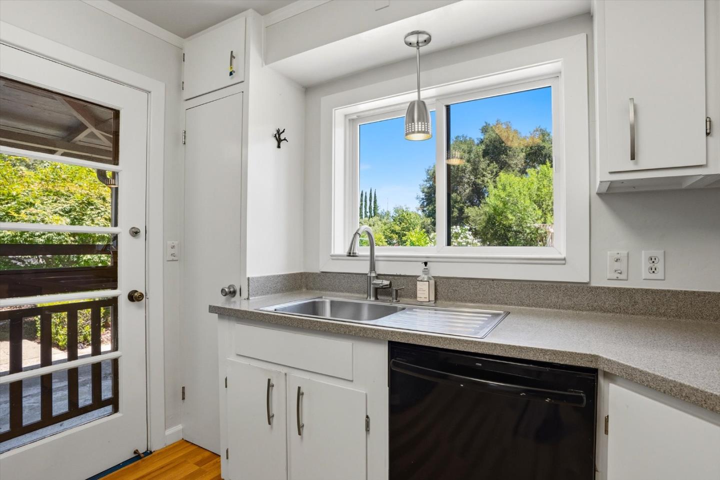 16899 Kennedy Road Los Gatos, CA 95032 - Photo 15 of 61 a kitchen with stainless steel appliances granite countertop a sink and a window