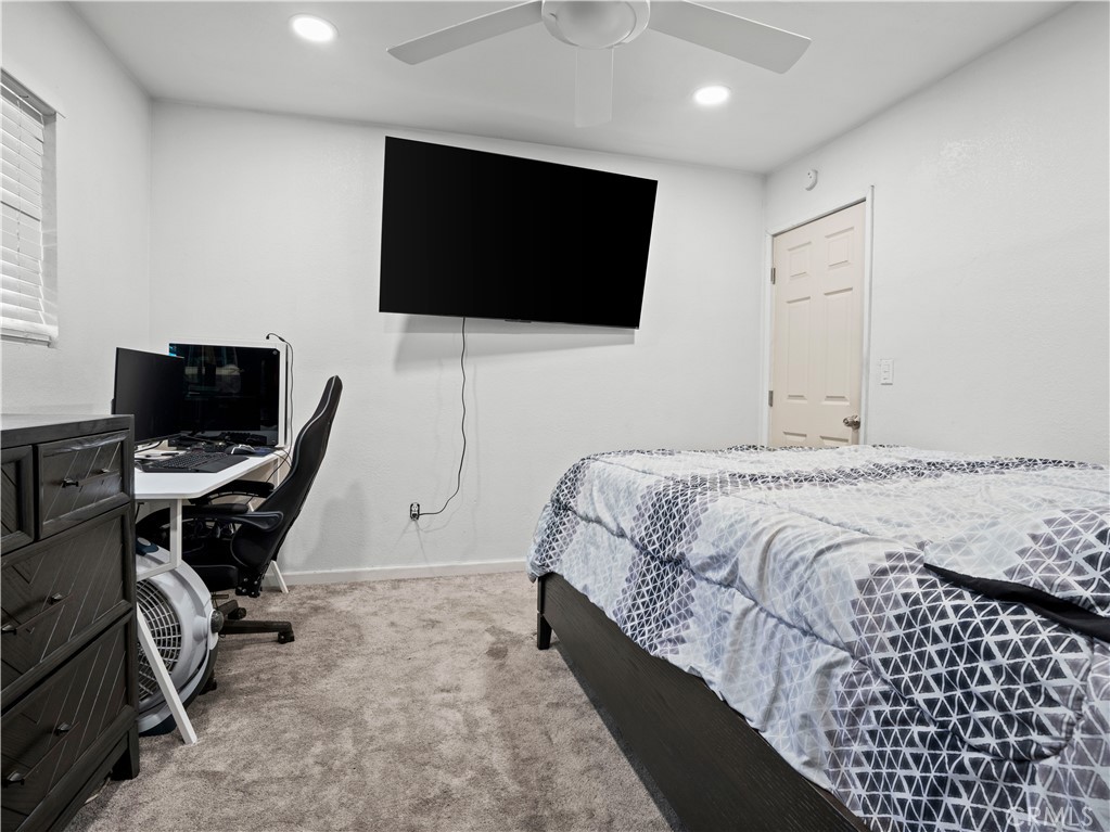 1455 North Alice Avenue Rialto, CA 92376 - Photo 17 of 23 a bedroom with a bed and a flat screen tv
