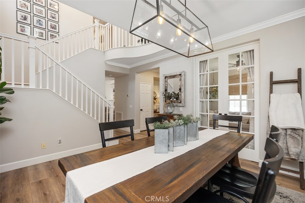 42 Livingston Place Ladera Ranch, CA 92694 - Photo 11 of 34 a view of a dining room with furniture window and wooden floor