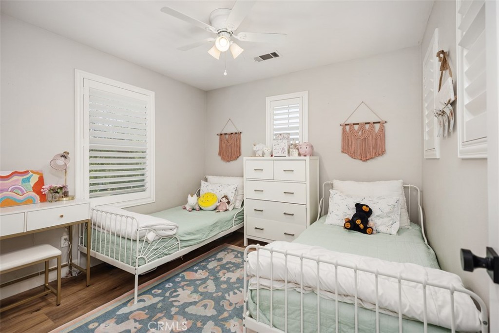 42 Livingston Place Ladera Ranch, CA 92694 - Photo 22 of 34 a bedroom with a bed and a window