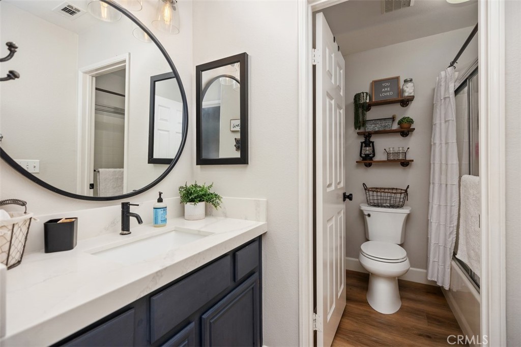 42 Livingston Place Ladera Ranch, CA 92694 - Photo 24 of 34 a bathroom with a sink a toilet and a mirror