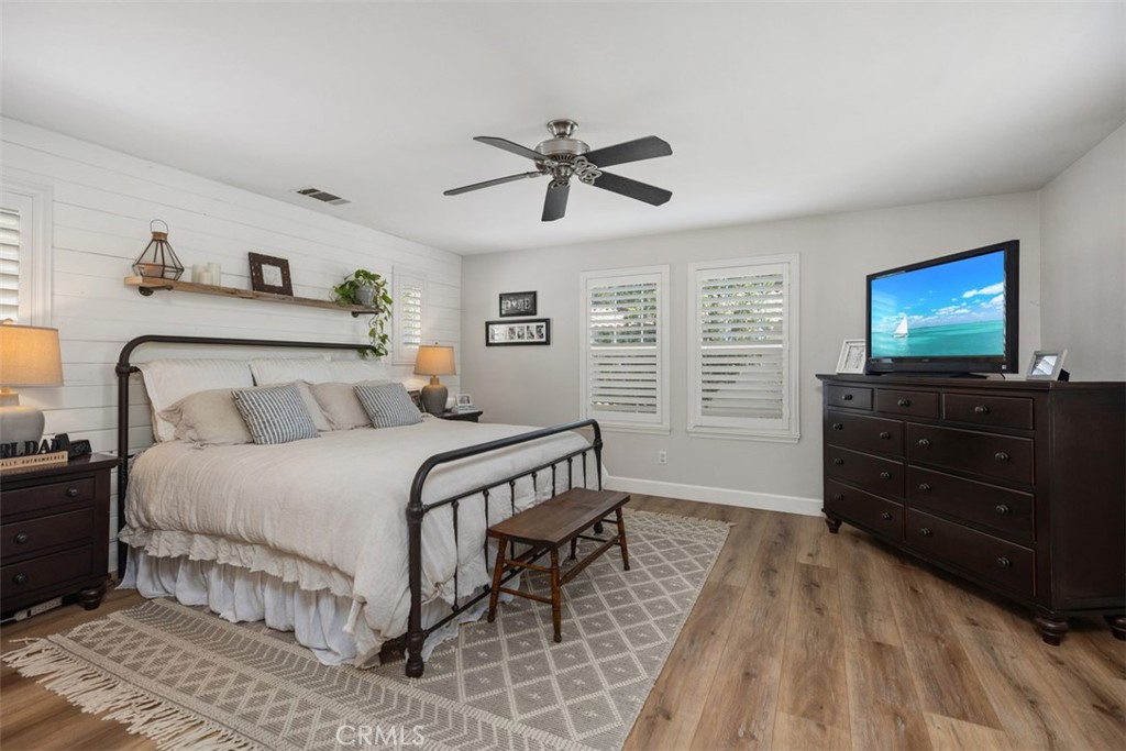 42 Livingston Place Ladera Ranch, CA 92694 - Photo 28 of 34 a bedroom with a bed and a flat screen tv