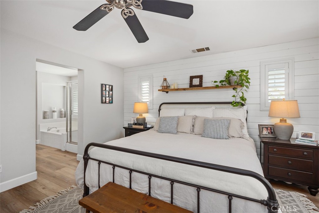 42 Livingston Place Ladera Ranch, CA 92694 - Photo 29 of 34 a bedroom with a bed and wooden floor