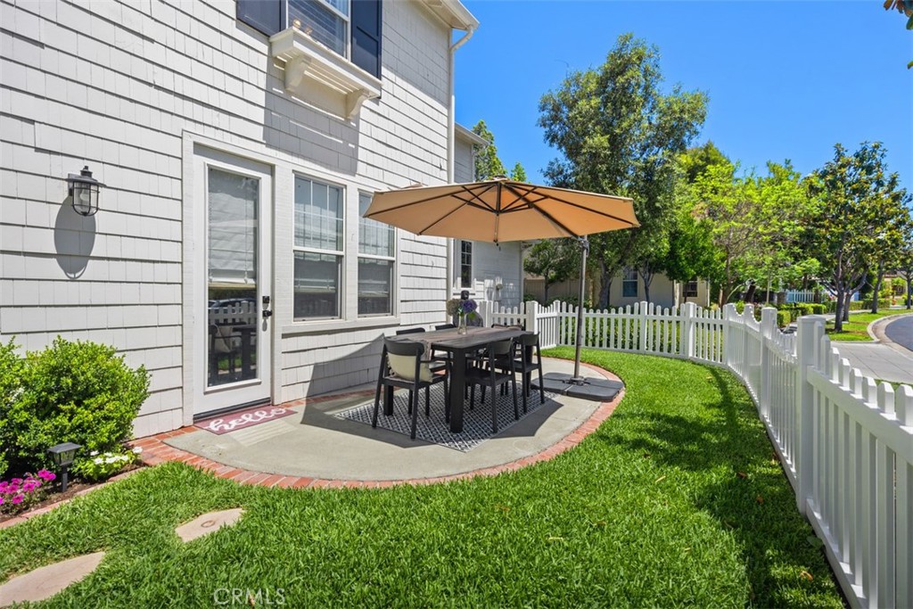 42 Livingston Place Ladera Ranch, CA 92694 - Photo 32 of 34 a view of a chair and table in backyard of the house