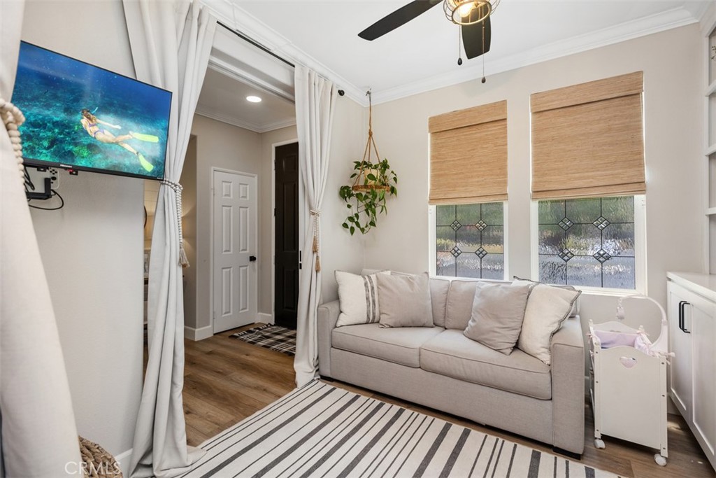 42 Livingston Place Ladera Ranch, CA 92694 - Photo 8 of 34 a living room with furniture and a floor to ceiling window
