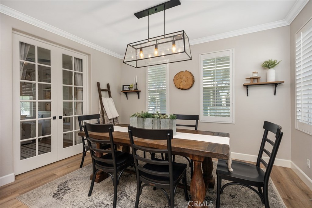 42 Livingston Place Ladera Ranch, CA 92694 - Photo 10 of 34 a view of a dining room with furniture and a large window