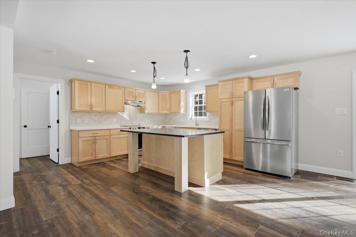 196 Fawn Hill Road Prattsville, NY 12468 - Photo 15 of 45 a kitchen with stainless steel appliances granite countertop a refrigerator a sink a stove and white cabinets