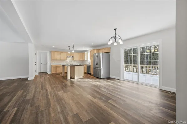 a view of kitchen with cabinets and wooden floor