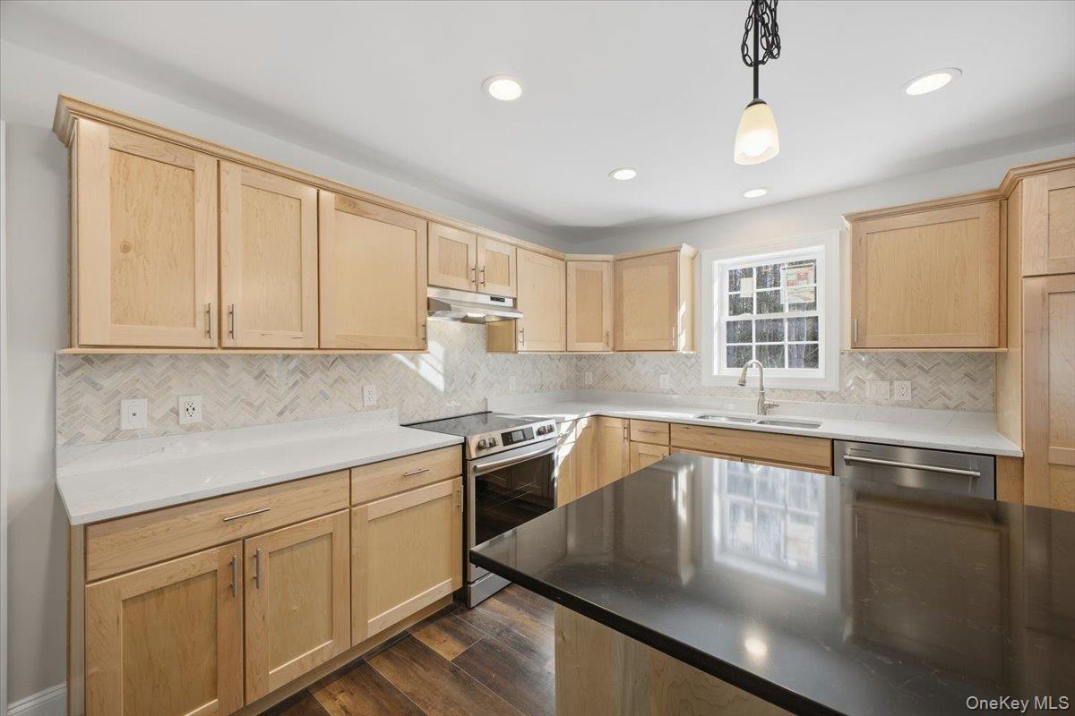 196 Fawn Hill Road Prattsville, NY 12468 - Photo 19 of 45 a kitchen with granite countertop cabinets stainless steel appliances a sink and a window