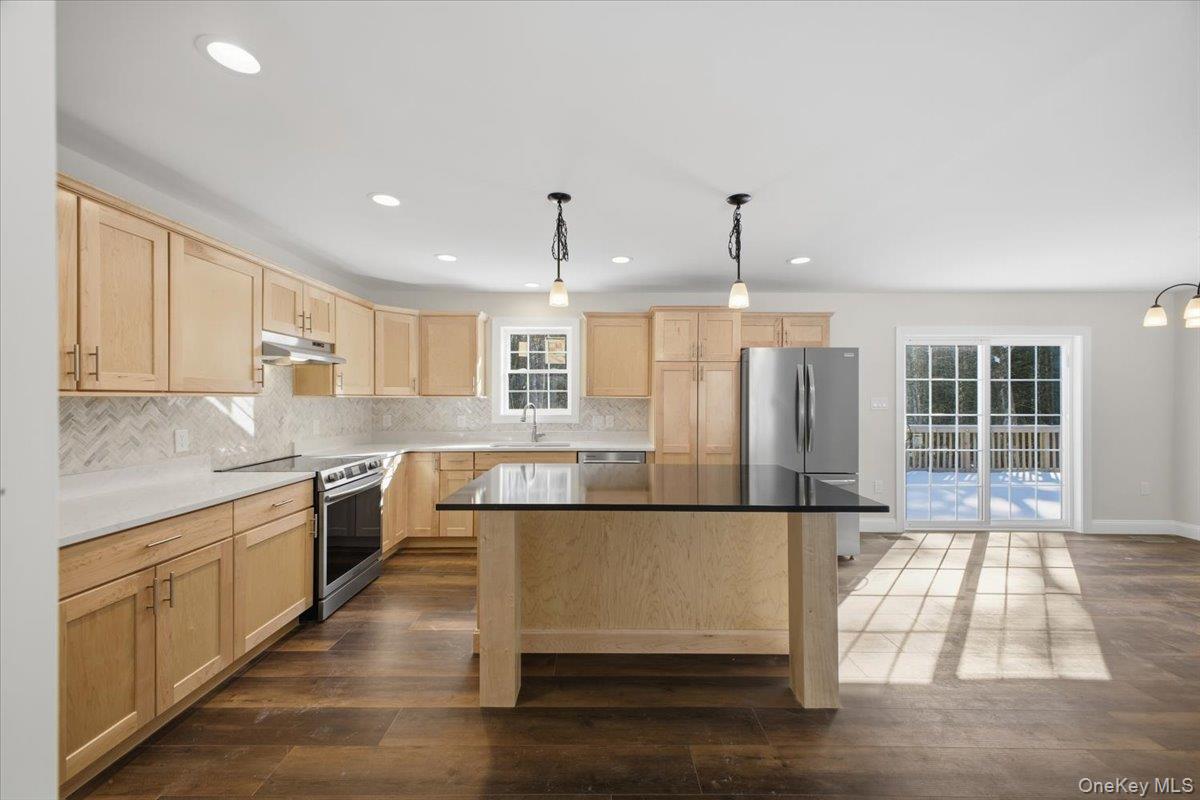 196 Fawn Hill Road Prattsville, NY 12468 - Photo 20 of 45 a large kitchen with stainless steel appliances granite countertop a granite counter tops and a window