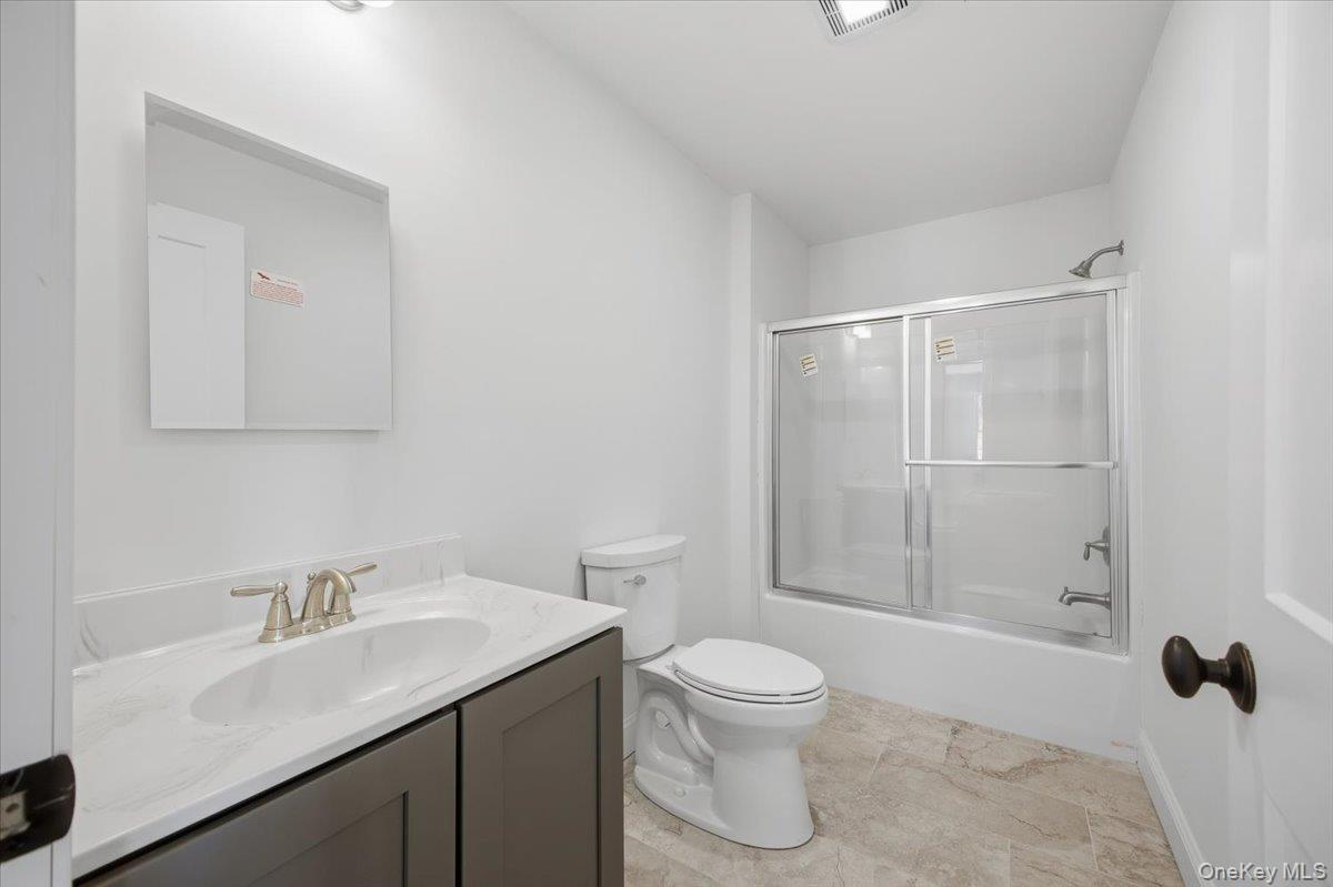 196 Fawn Hill Road Prattsville, NY 12468 - Photo 23 of 45 a bathroom with a sink toilet and vanity