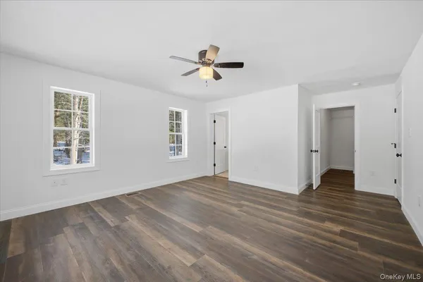 a bathroom with a sink shower and a mirror