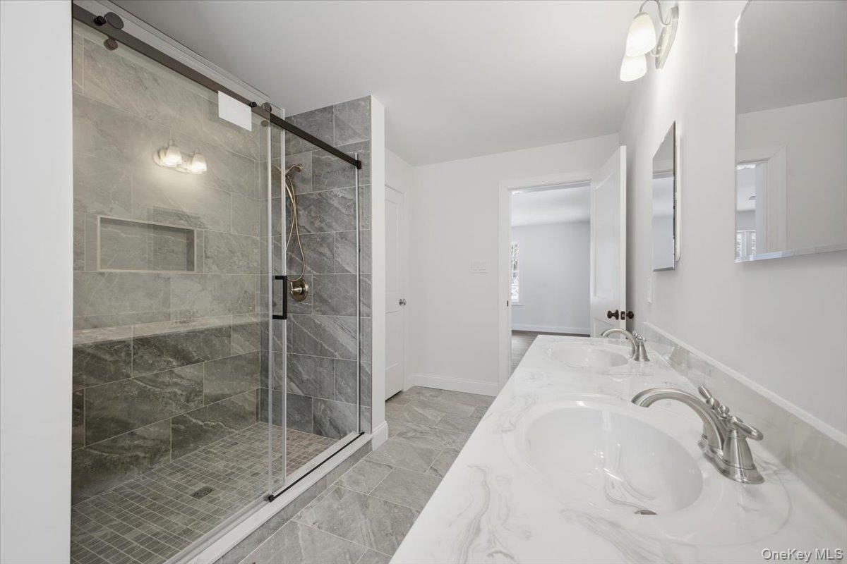 196 Fawn Hill Road Prattsville, NY 12468 - Photo 30 of 45 a bathroom with a bathtub shower sink and mirror