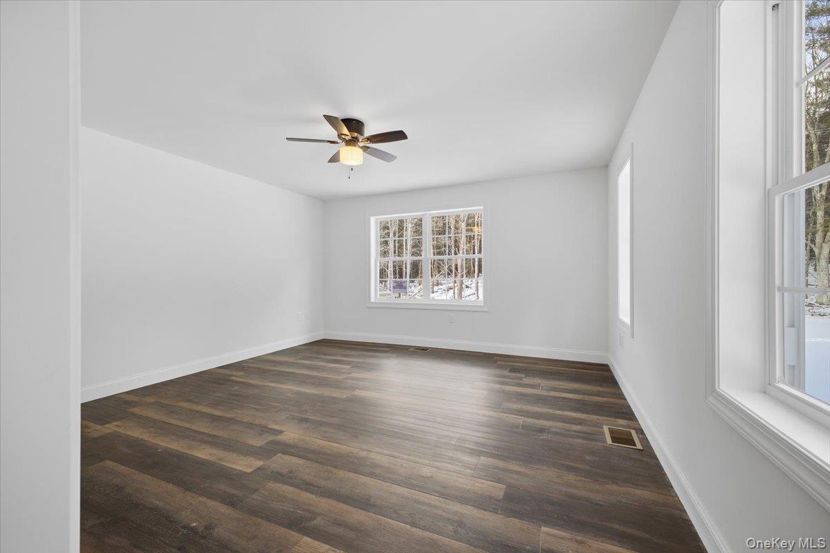 196 Fawn Hill Road Prattsville, NY 12468 - Photo 32 of 45 wooden floor in an empty room with a window