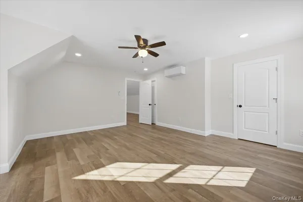 a bathroom with a granite countertop sink a toilet and shower