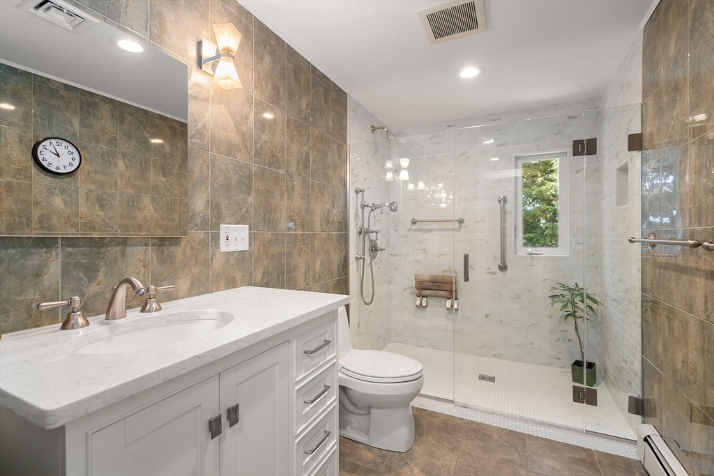 50 Mary Ellen Road Newton, MA 02468 - Photo 9 of 22 a bathroom with a sink a toilet and shower