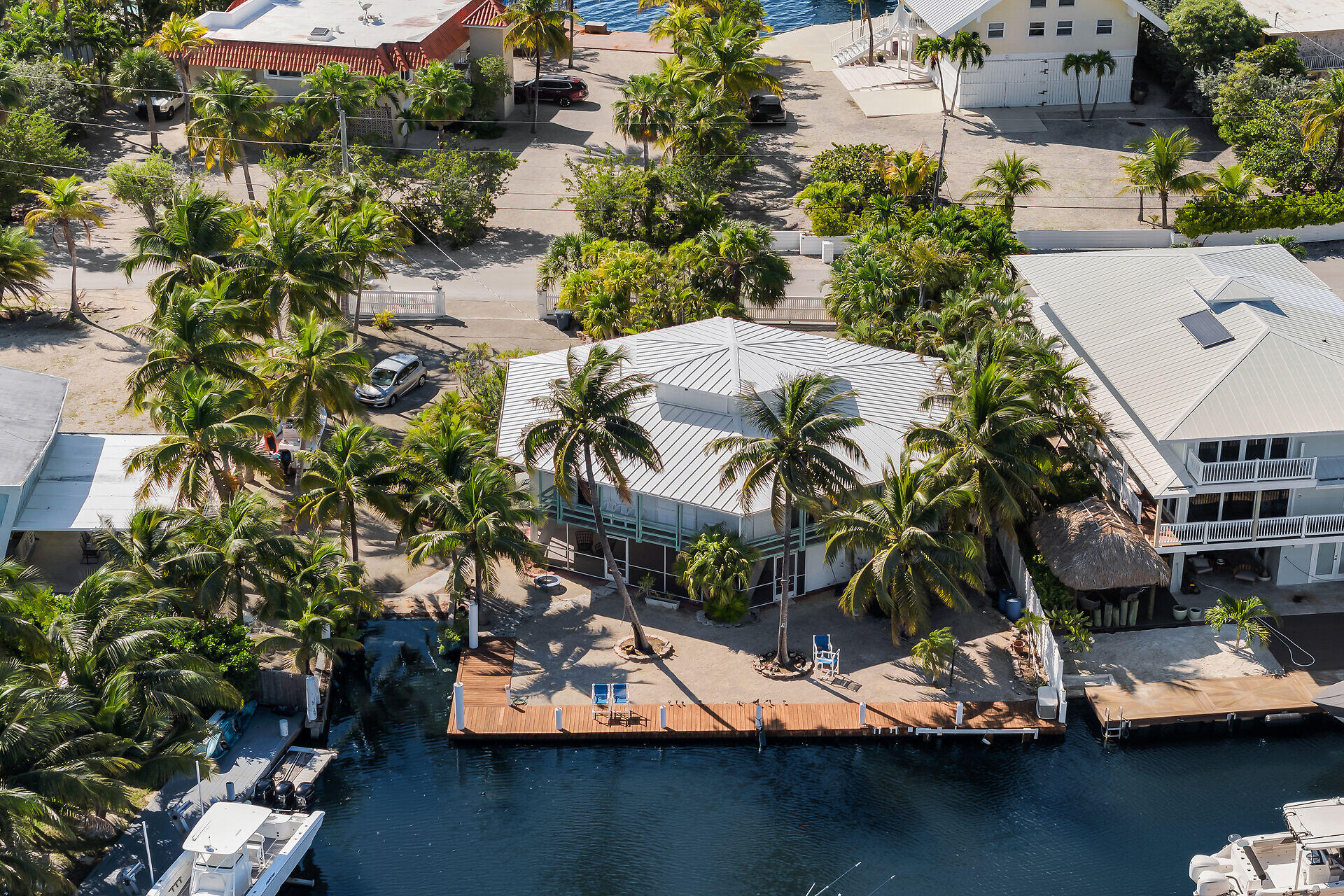 Undisclosed Address Key Largo, FL 33037 - Photo 1 of 69 an aerial view of residential houses with outdoor space
