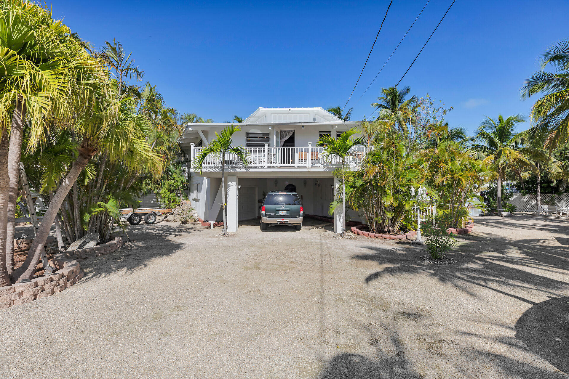 Undisclosed Address Key Largo, FL 33037 - Photo 15 of 69 a front view of a house with a yard