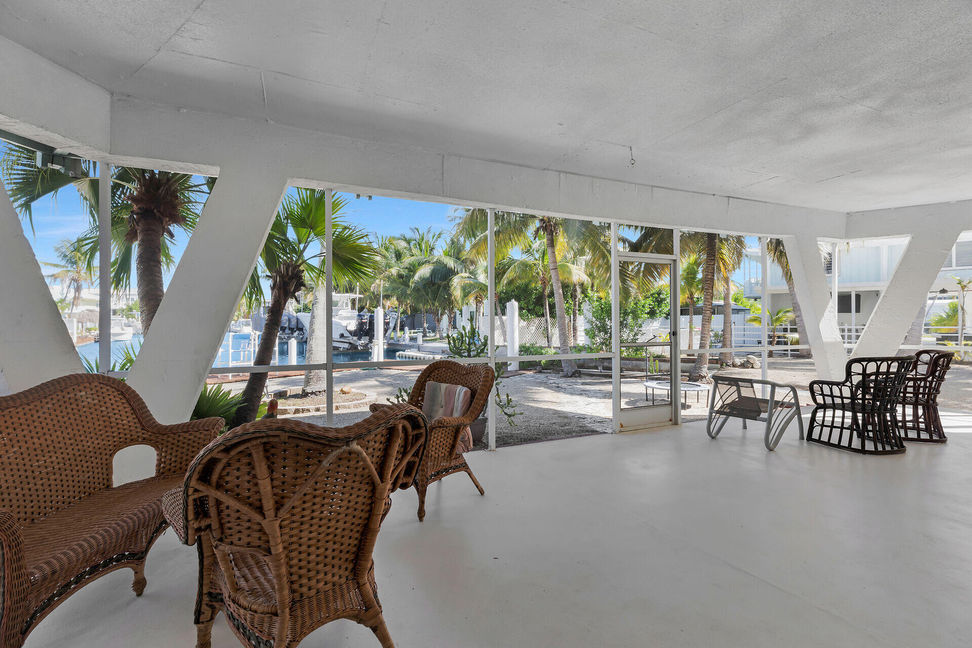 Undisclosed Address Key Largo, FL 33037 - Photo 27 of 69 a living room with furniture and a large window