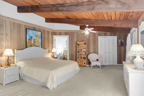 a bedroom with furniture and a dresser