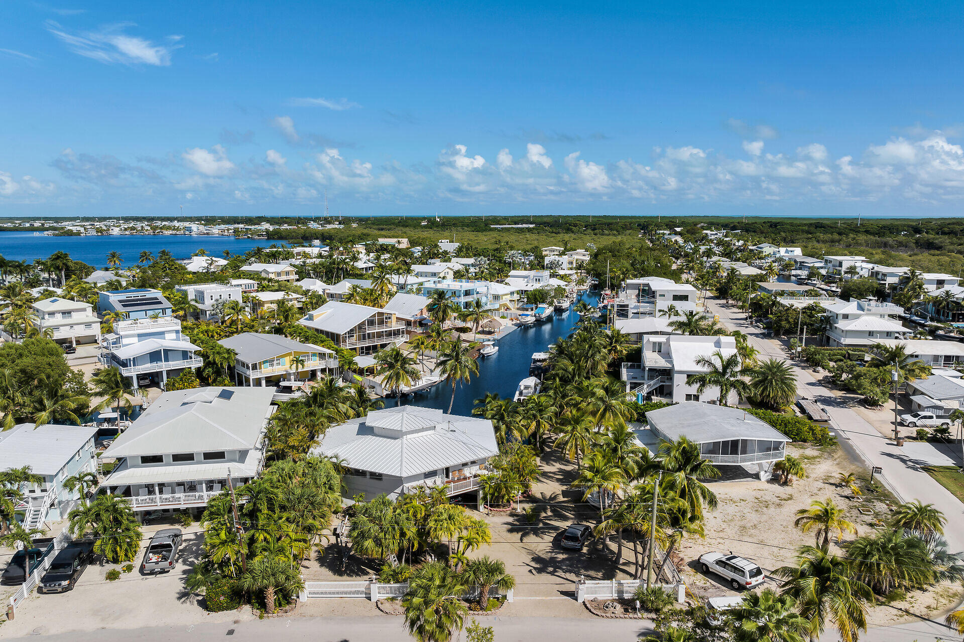 Undisclosed Address Key Largo, FL 33037 - Photo 5 of 69 a view of a city with lots of residential buildings ocean and mountain view in back