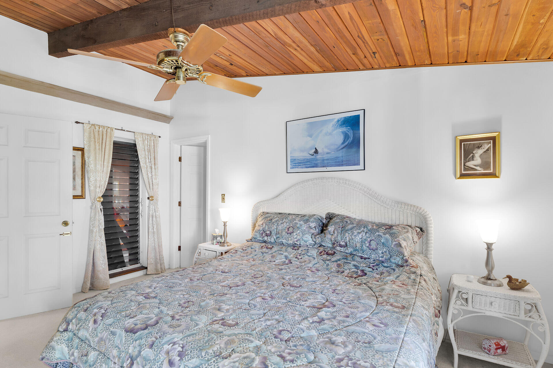 Undisclosed Address Key Largo, FL 33037 - Photo 51 of 69 a bedroom with a bed and a dresser