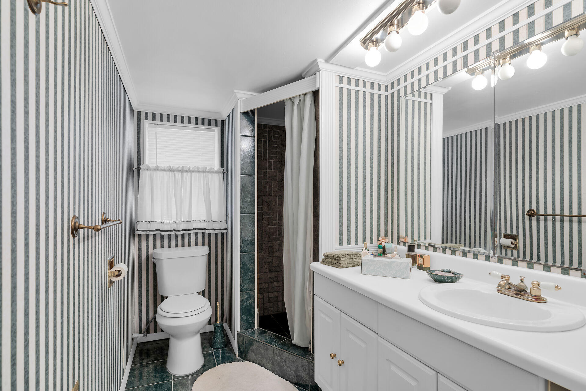 Undisclosed Address Key Largo, FL 33037 - Photo 54 of 69 a bathroom with a sink a toilet and shower