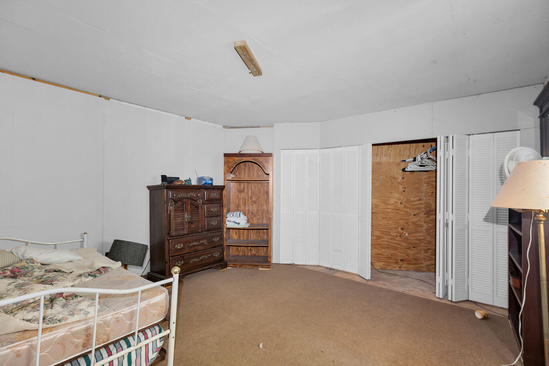 Undisclosed Address Key Largo, FL 33037 - Photo 58 of 69 a bedroom with furniture and a dresser