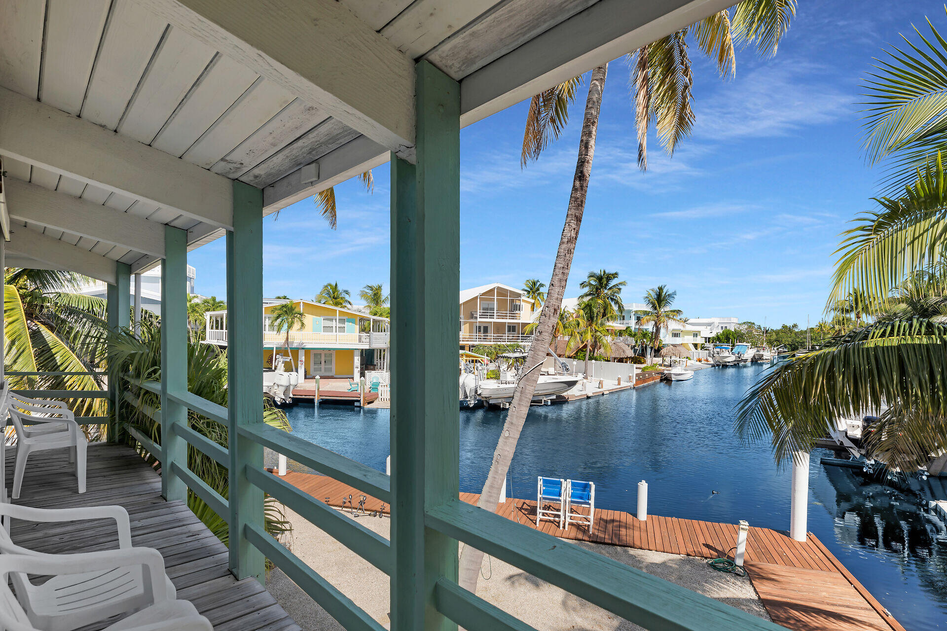 Undisclosed Address Key Largo, FL 33037 - Photo 9 of 69 a view of a balcony with chairs