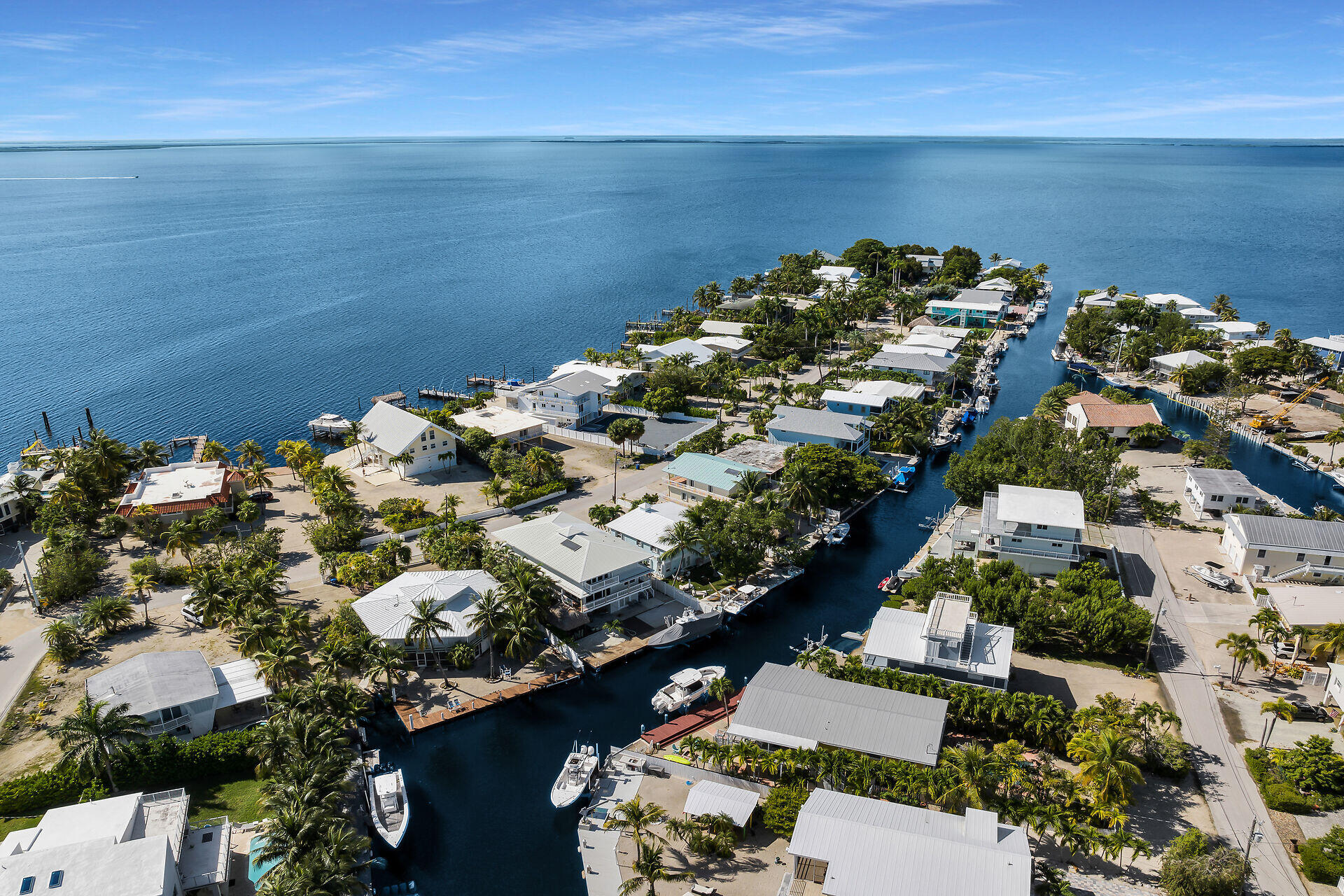 Undisclosed Address Key Largo, FL 33037 - Photo 10 of 69 an aerial view of a houses with a lake view