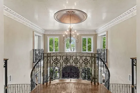 a dining room with stainless steel appliances kitchen island granite countertop a dining table chairs and view living room