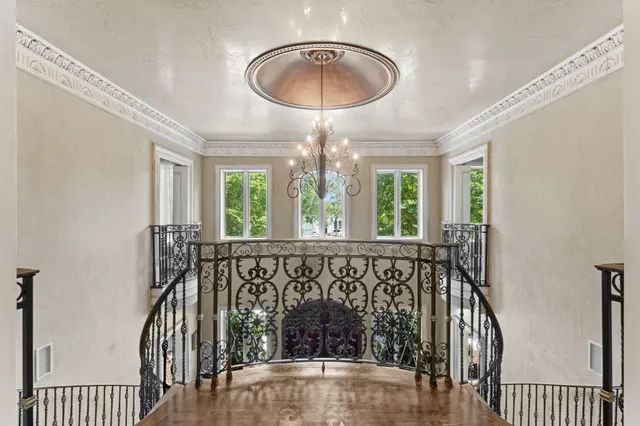 a dining room with stainless steel appliances kitchen island granite countertop a dining table chairs and view living room