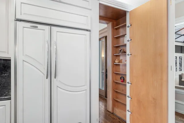 a spacious bathroom with a tub sink and mirror