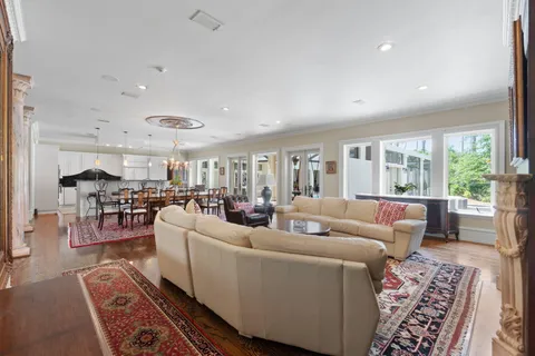 a spacious bathroom with a granite countertop sink and a mirror