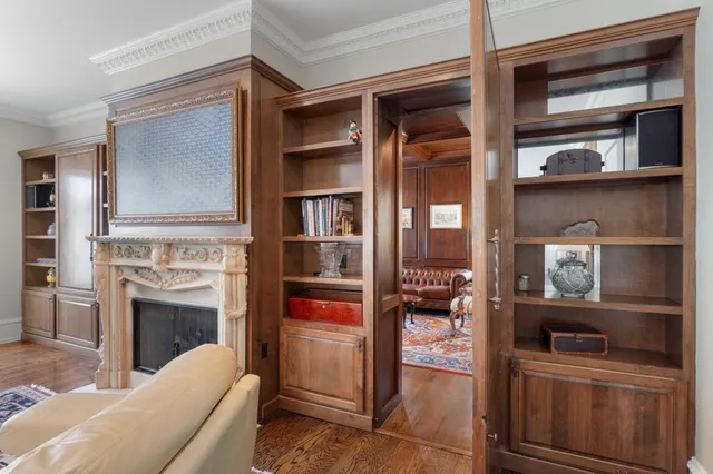 a spacious bedroom with a bed a couch and a window