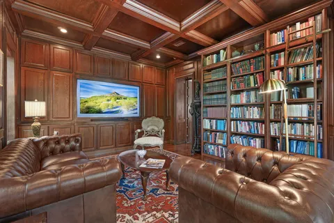 a spacious bathroom with a granite countertop sink a mirror and a shower