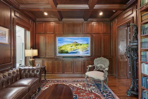 a bathroom with a granite countertop sink a mirror and a shower